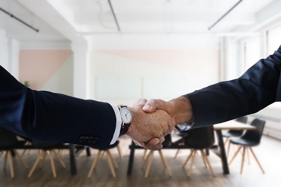 clients shaking hands after a successful mediation process